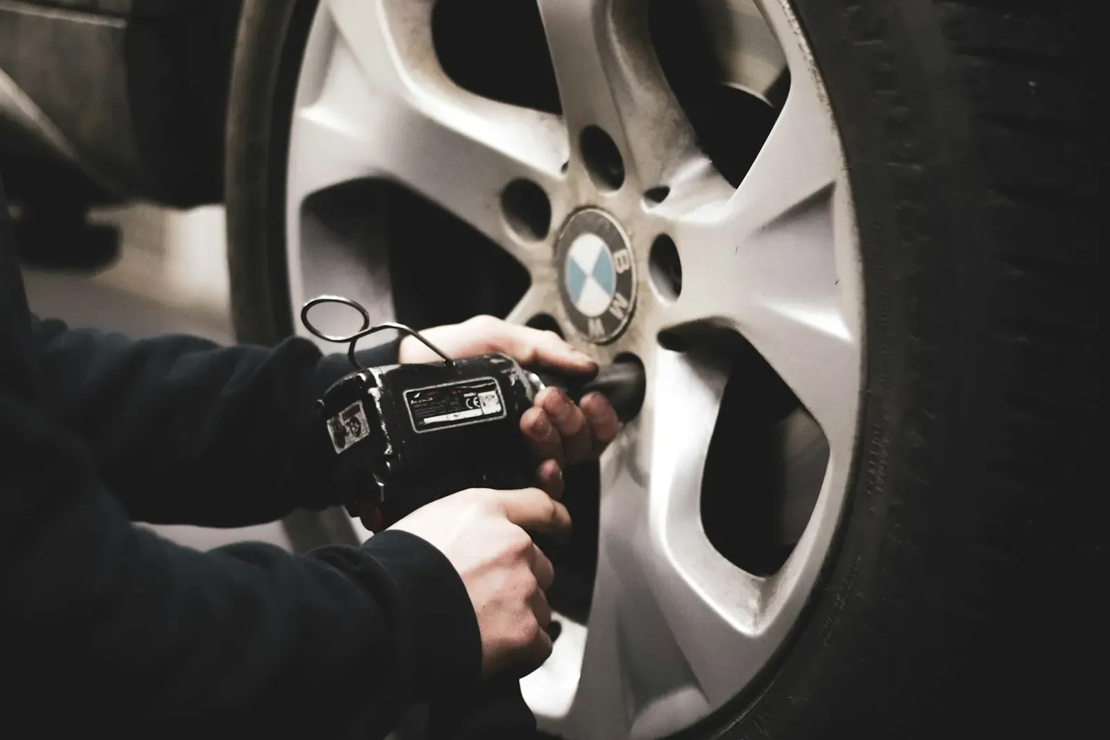 Technician removing a wheel to inspect internal brake components during an Ontario safety inspection